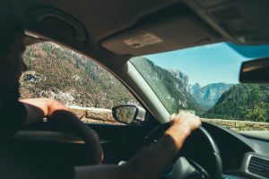 young man driving car in south west US